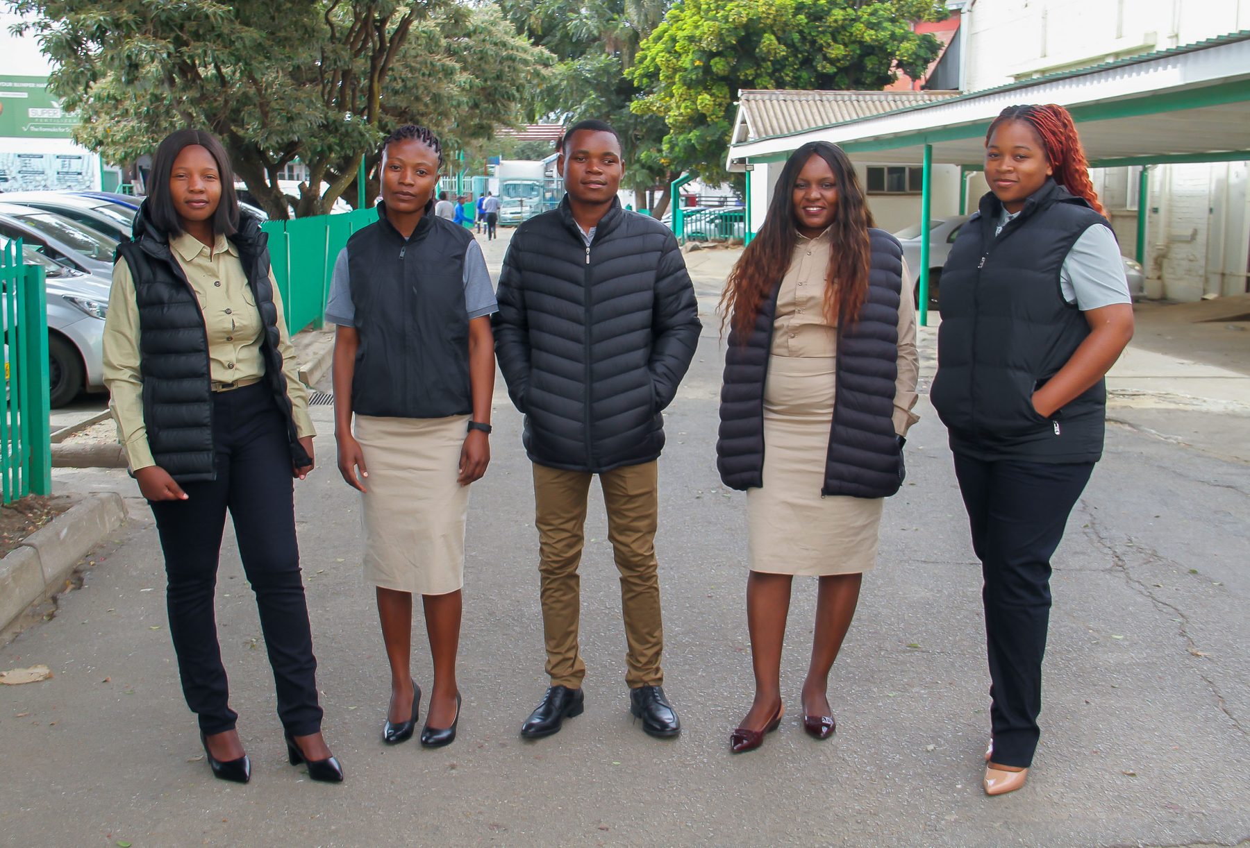 NECST team in branded field jackets and business casual wear